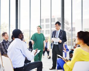 Diverse People Listening to the Doctor's Presentation