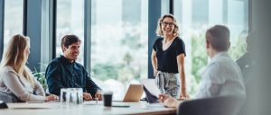 group of happy employees in conference room