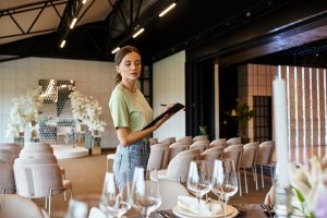 hospitality professional surveying table settings
