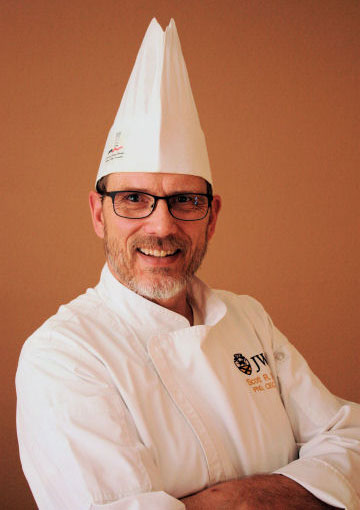 Headshot of Chef Scott Smith in chef's hat. 