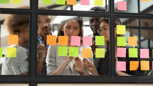 project managers looking at sticky notes