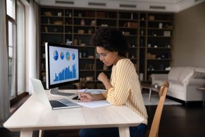marketing professional viewing analytics on computer