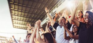 sports fans cheering at game