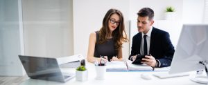 two professionals working in an office