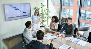professionals reviewing market research