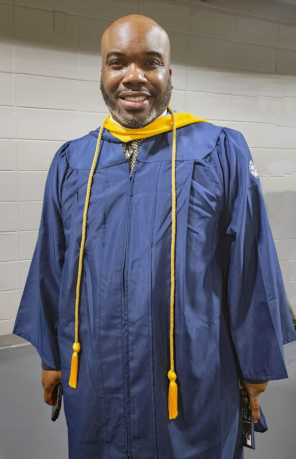 Chef Daniel Thomas in his graduation gown.