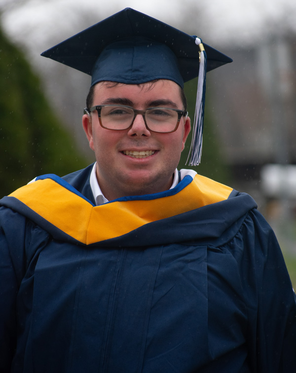 Demetri Sianis in graduation gap and gown.