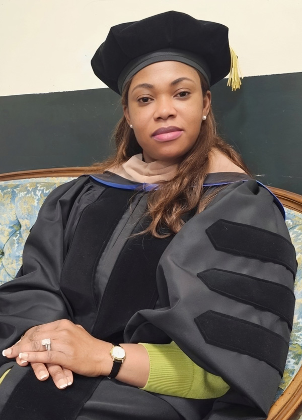Dr. Ella Asare Afortor in her doctoral graduation cap and robes.
