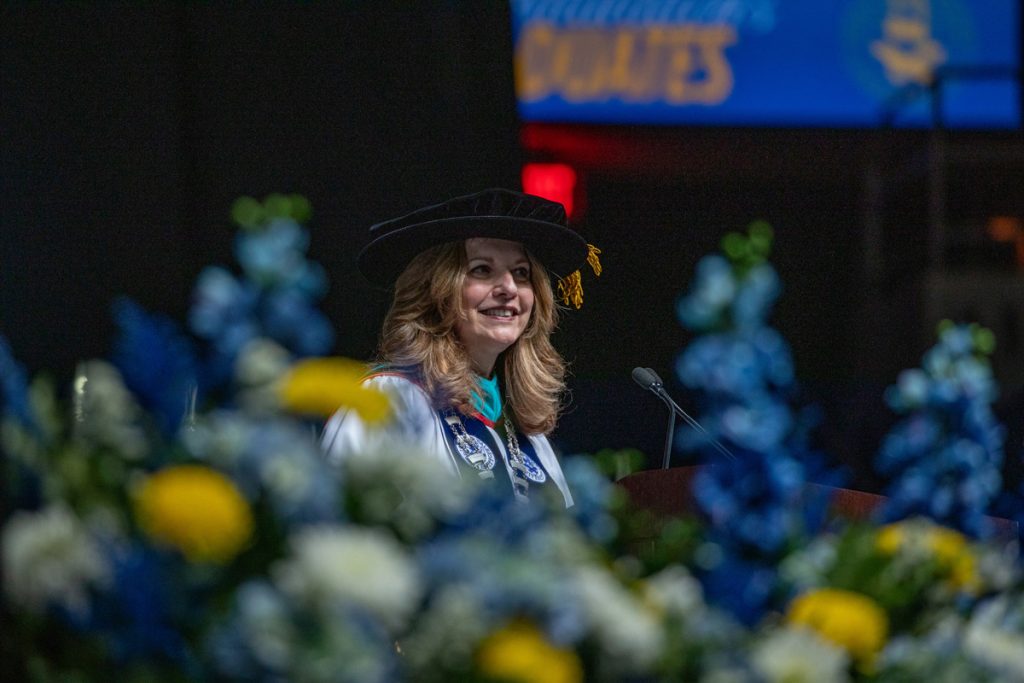 Johnson & Wales President, Marie Bernardo-Sousa, at the podium during the 2025 Commencement in Providence.