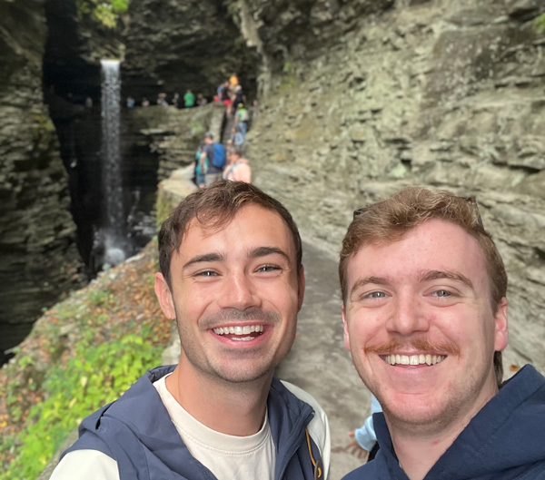 Two young men, Ben and Caleb, smiling.
