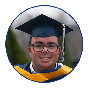 Image of a young man smiling with his cap, gown, and stole