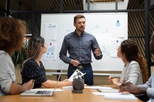 business leader speaking to coworkers