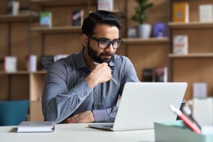 professional working at laptop