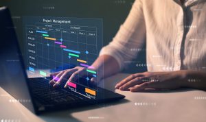 Project manager working on laptop