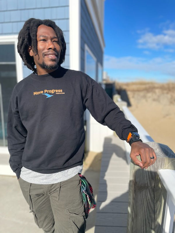 Markeith standing outside on a deck.