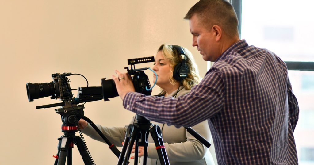 Multimedia developers filming the video for the Criminalistics program.