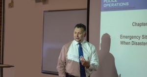 Professor Paul Sylvestre making a presentation with a PowerPoint.