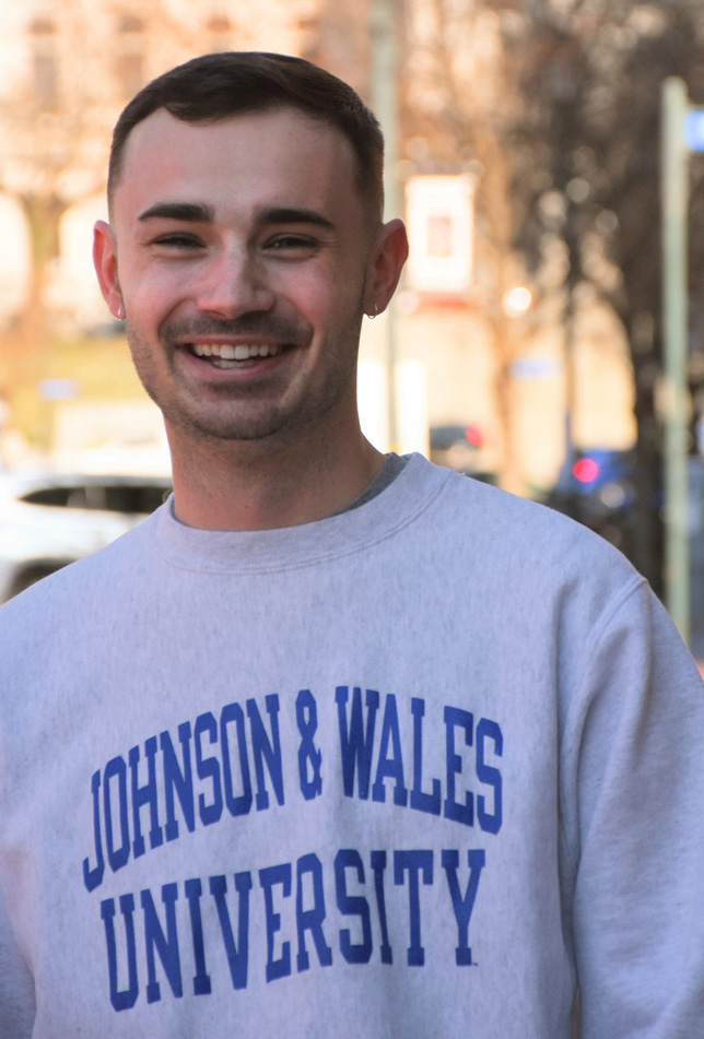 Portrait of Ben Huntzinger wearing his Johnson & Wales sweatshirt.