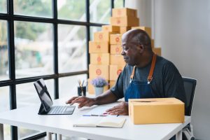 man working on a tablet in a home office