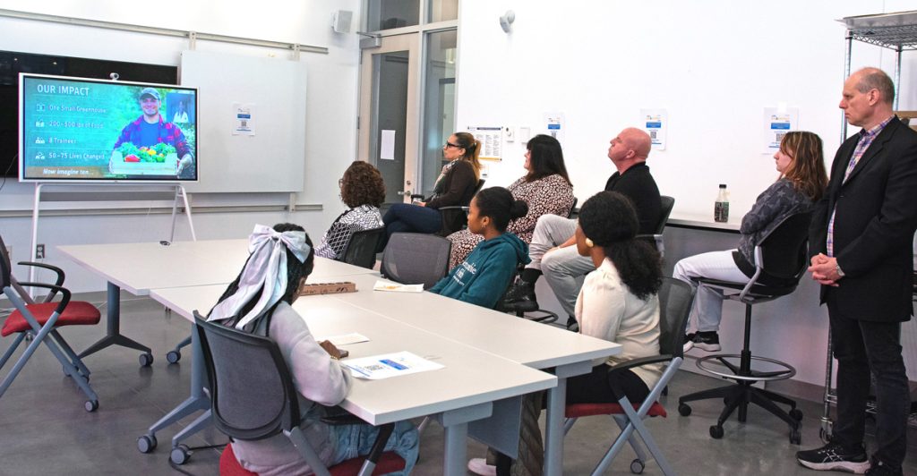 Sharkfest 2026 attendees in a classroom, watching a presentation on the vibe board.
