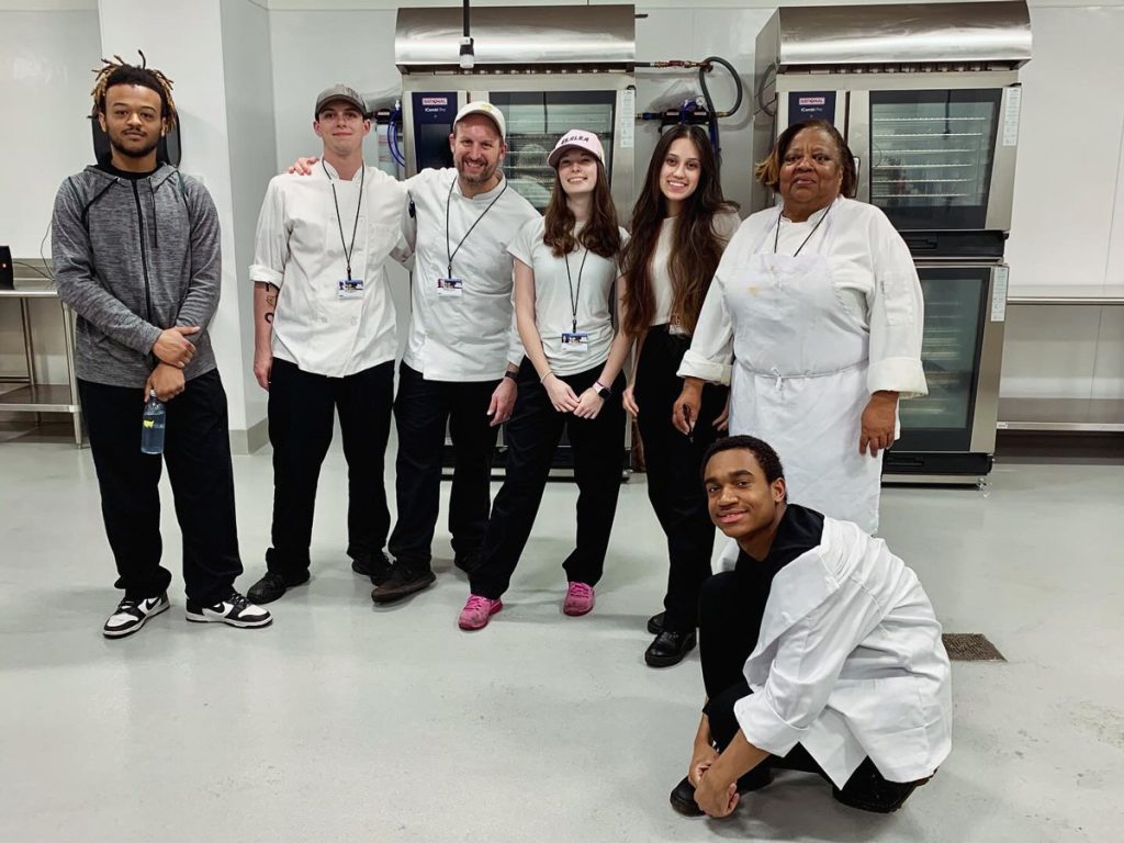 Stephen Taylor with his mixed gender and multiethnic kitchen crew at the Philadelphia Cricket Club.