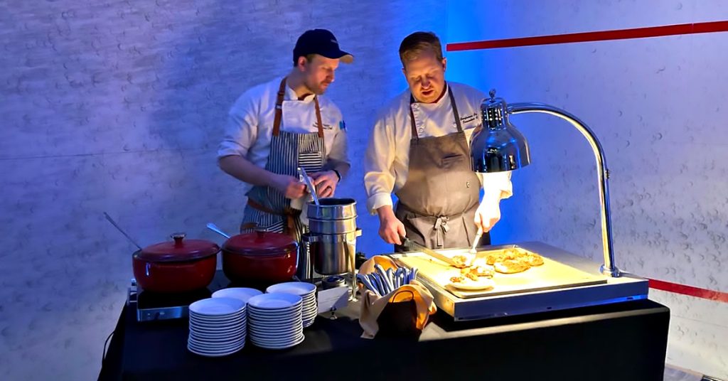 Stephen Taylor with the executive chef doing a walk-through of the food prep for an event.