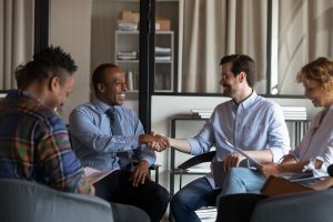 colleagues shake hands