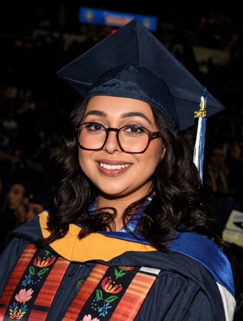 Headshot of Monica Arvizu in her cap and gown after the commencement ceremony at the Amica Mutual Pavilion