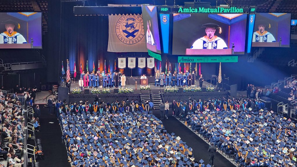 View of the undergraduates and the stage during the commencement ceremony at the Amica Mutual Pavillon..