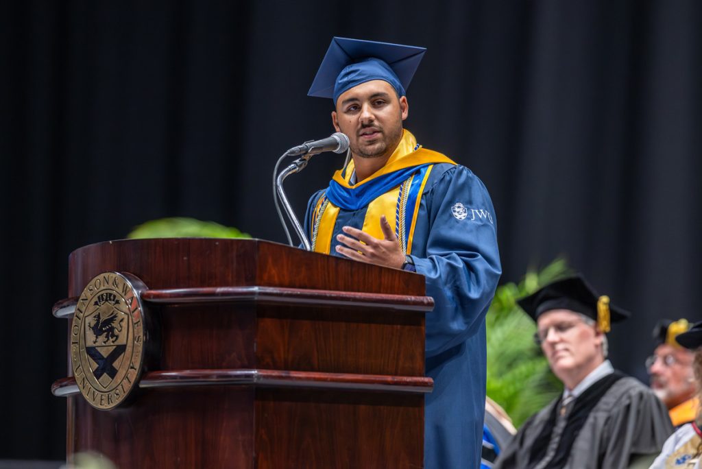 Alumni Speaker Angela Kimbrough at the podium in the Bojangles Coliseum, Charlotte, North Carolina.