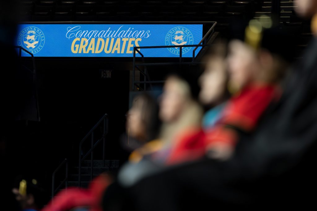 Sign in the arena during the Providence Commencement Ceremony: Congratulations Graduates.