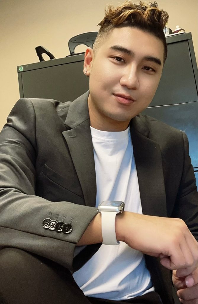 Portrait of Yee Tran in business casual clothing on the job.