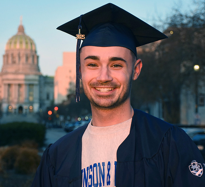 Headshot of Ben Huntzinger in cap and gown.