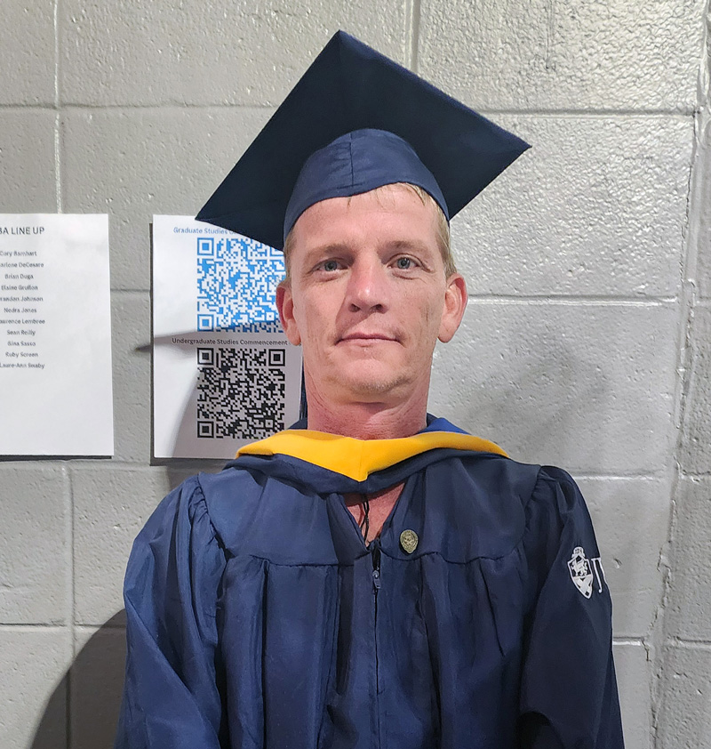 Headshot of Joshua Orndorff in his cap and gown.